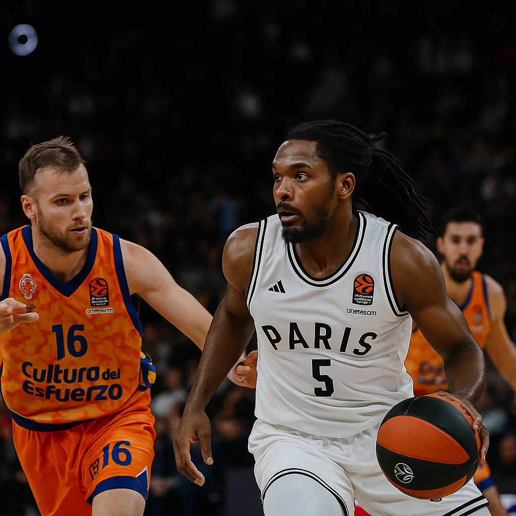 Joueur du Paris Basketball en action face à un défenseur de Valence Basket lors d’un match d’EuroLeague à l’Adidas Arena.